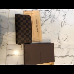 Louis Vuitton zip wallet. Worn handful of times.